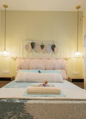 a bedroom with a large bed with towels on it at Paul's Horizon in Chios