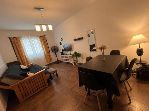 a living room with a table and a couch at Olivos Stay in Olivos