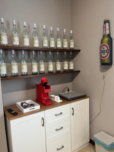 a room with a bunch of bottles on shelves at B&B La Tenuta in Fermo