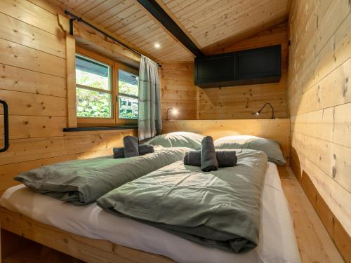 a bedroom with two beds in a log cabin at MAYR 74 in Wörgl