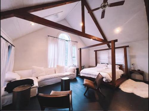 a large room with a bed and a couch at The Land - Retreat Center In Beautiful Nature - Bay Area Northern California in Philo