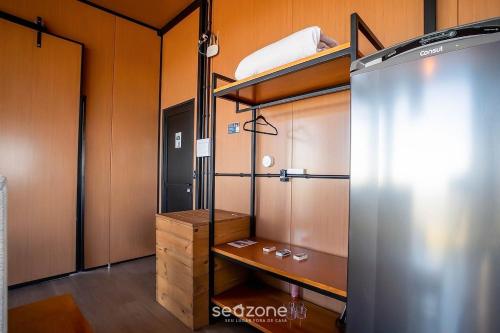 a room with a bunk bed and a closet at Charming chalet with fireplace and hot tub! VST045 in Annitapolis