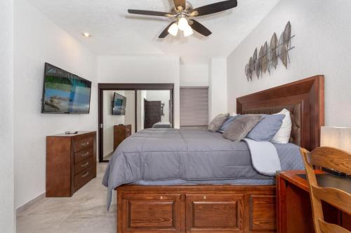 a bedroom with a bed and a ceiling fan at Ground Floor Sonoran Sea 112-W in Puerto Peñasco