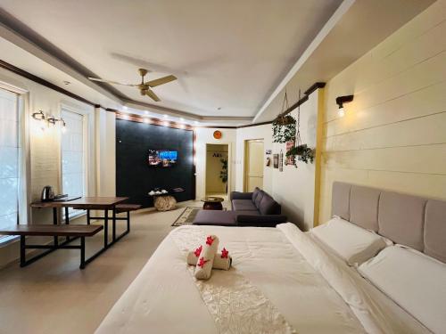 a bedroom with a bed and a living room at Castle View Hotel Resort in Samal