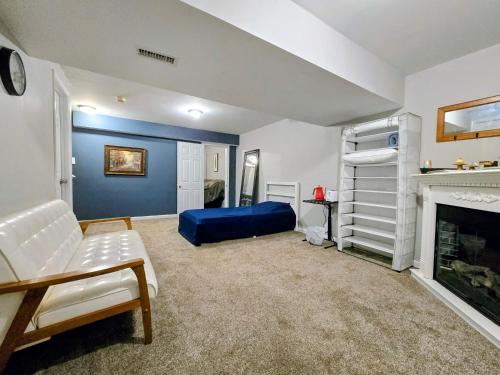 a living room with a couch and a fireplace at MALE Only Shared Basement in Frederick