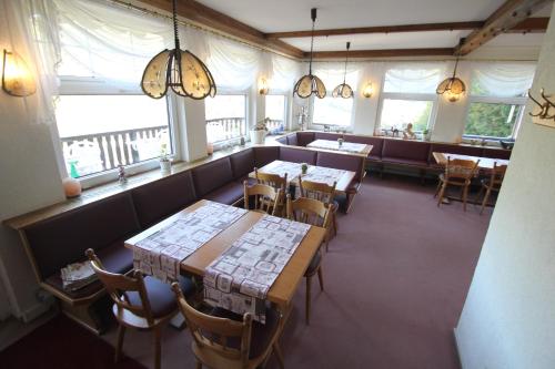 an overhead view of a restaurant with tables and chairs at Hotel SchwarzaBurg in Schwarzburg
