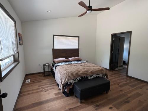 a bedroom with a bed and a ceiling fan at Driftless Destinations in McGregor