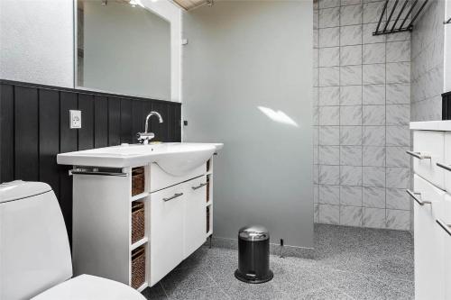 a bathroom with a sink and a toilet at 13383-Asnaes-Glentevej-15 in Asnæs