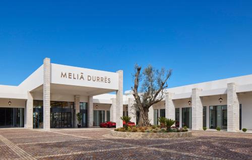 a building with a sign that reads melia dunas at Meliá Durres Albania in Draç