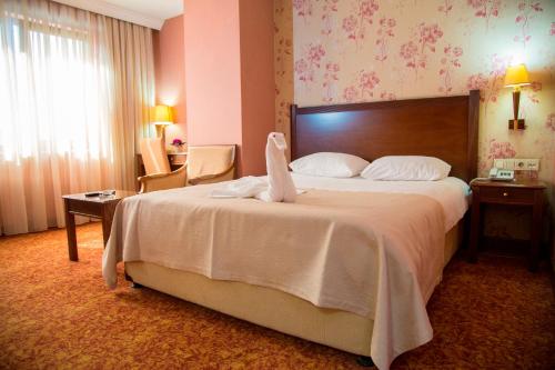 Cama o camas de una habitación en Kelesler Park Hotel