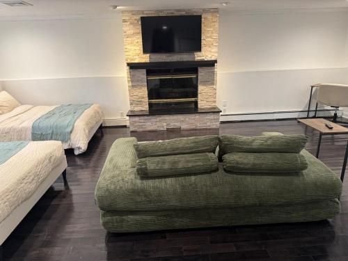 a living room with a couch and a fireplace at Studio - NYC, Greenwich, Capitol, Parking in Port Chester