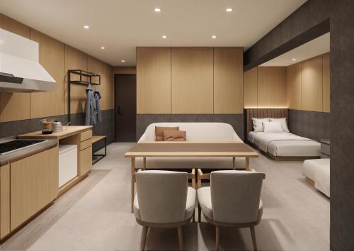 a kitchen and a bedroom with a bed and a table at KABIN Shiro - Regale Collection in Osaka