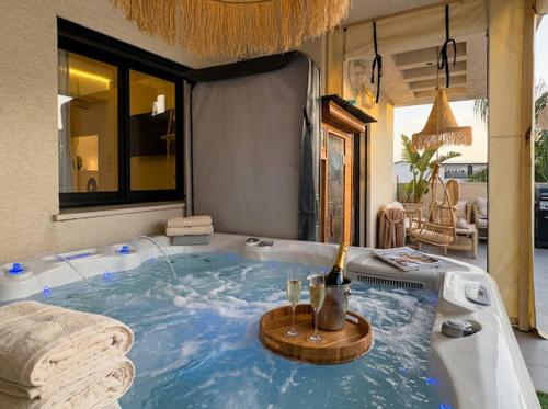 a bathroom with a jacuzzi tub in a room at טל תאי בוטיק - Tal Thai Boutique in Shelomi