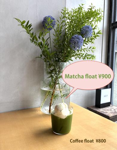 a vase with a vase with flowers in it at AET & o3 HOTEL in Tokyo
