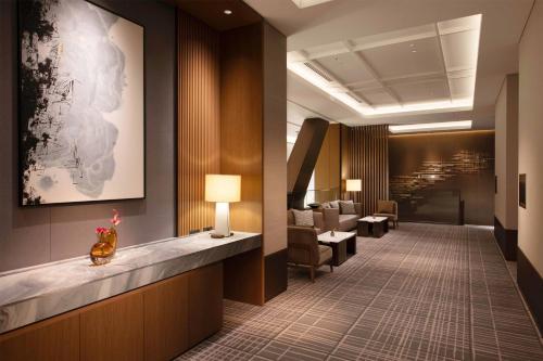 a lobby of a hotel with a waiting room at Conrad Nagoya in Nagoya