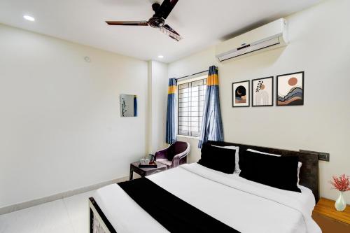 a bedroom with a bed and a window at Hotel O SNIST University Hyderabad Formerly Hari Hara Enterprise in Maula Ali