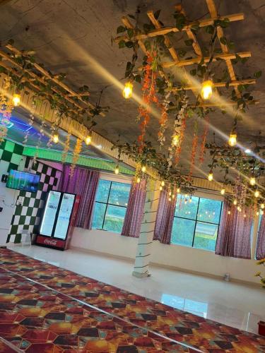 a room with a stage with a large rug at HOTEL SHEKHAR INN Luxury Suit in Agra