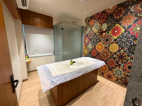 a bathroom with a shower and a counter with a sink at Hotel Royal Galleria in Vadodara