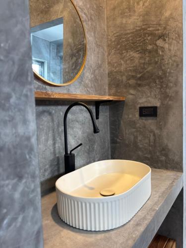 a bathroom with a white sink and a mirror at Big leaf villa cozy in Bangrak Beach