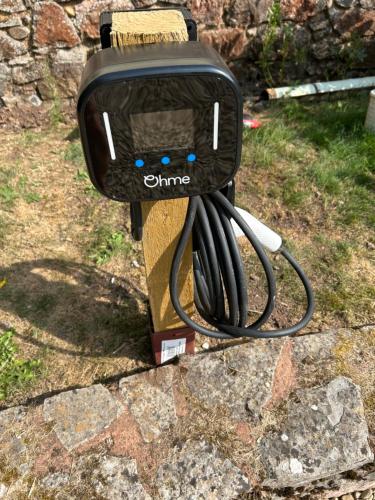 a iron sitting on top of a stone yard at Hillhead Farm Bed and Breakfast in Cullompton