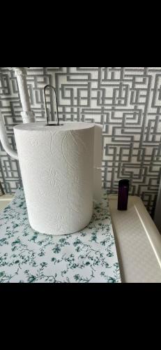 a roll of toilet paper sitting on top of a table at GIN Apartment No 82 SELF CHECK-IN in Mažeikiai