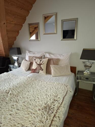 a bedroom with a bed with a deer on it at U Hanki in Biały Dunajec