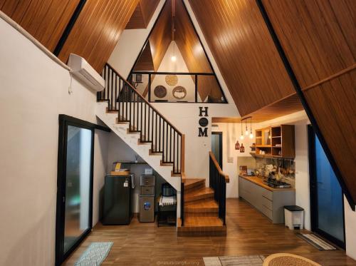 a hallway with a staircase in a house at Villa Kahuripan Triangle in Bandung