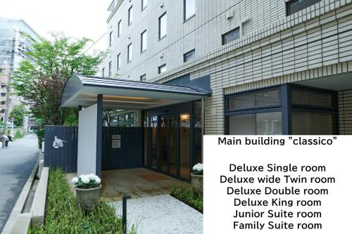 a building with a main building casabella and a sign at Shin-Osaka Station Hotel in Osaka