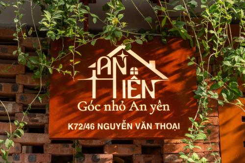 a sign that reads go into an van with a house at An Hiên Home in Danang