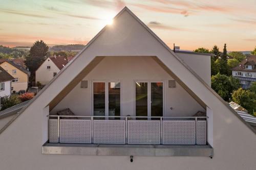 a view of a house with a balcony at Loft-Apartment Schloßsee in Salem