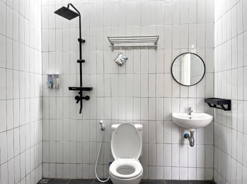 a bathroom with a toilet and a sink at Heavenly 1 - Private Triangle in Bandung