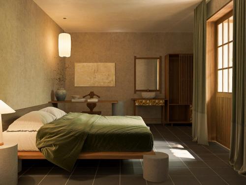 a bedroom with a bed and a table and windows at Châu Home in Ninh Binh
