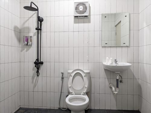 a bathroom with a toilet and a sink at Himalaya 2 - Private Triangle in Bandung