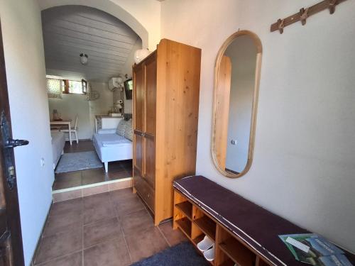 a room with a hallway with a mirror and a table at Seosko turističko domacinstvo Imunsan in Niš