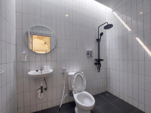 a bathroom with a toilet and a sink and a mirror at Himalaya 1 - Private Dome in Panjadakan