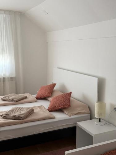 two beds with pillows on them in a bedroom at Villa Medina in Sarajevo