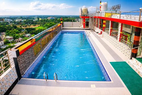a swimming pool on top of a building at Star International Rajshahi - Near Aam chattar in Rājshāhi