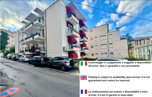 a picture of a building with cars parked on the street at Hotel Principe in Sanremo