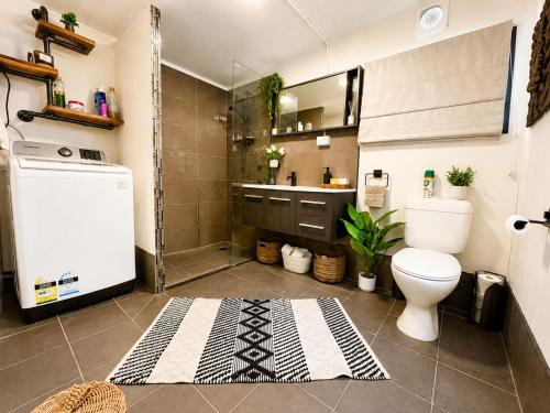 a bathroom with a toilet and a sink at Willow Cabin at The Reset Retreat in Charbon