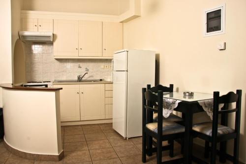 Sun Rise Hotel Apartmentsにあるキッチンまたは簡易キッチン