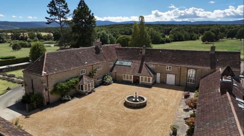 an aerial view of a house with a large yard at The Lighthouse Bed & Breakfast in Frome