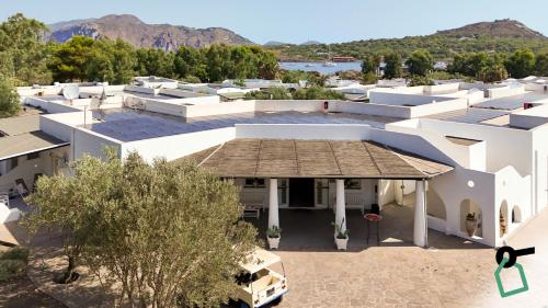 an overhead view of a white building with a roof at Hotiday Vulcano Porto in Vulcano
