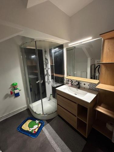 a bathroom with a shower and a toilet and a sink at Super Mario Studio ! in Jaunay-Clan