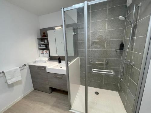 a bathroom with a shower and a sink at DOMITYS - Les Ambres in Cognac