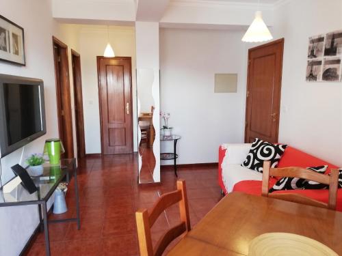 a living room with a couch and a table at Apartment with Mountain View in Eiriz – 65 sqm – Terrace in Eiriz