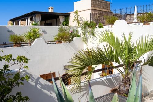 a white wall with plants on it at Exceptional Villa in Marrakech with Private Pool in Marrakesh