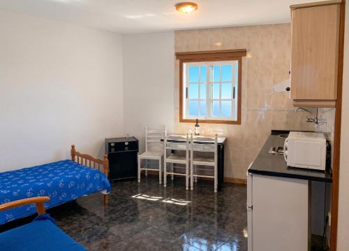 a small room with a kitchen and a table at Cosy Studio with Sea View and Garden in Frontera - 20 m² in Frontera