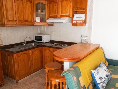 a kitchen with a sink and a counter with a microwave at Exceptional Studio in Frontera | 25 sq.m. | Terrace in Frontera