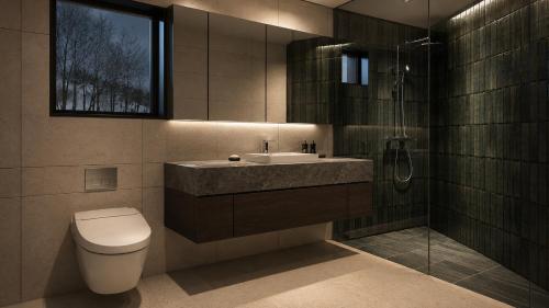 a bathroom with a sink and a toilet and a shower at Kira Kira Suites by H2 Life in Kutchan