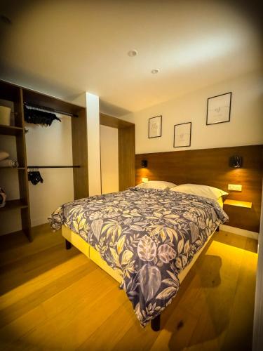 a bedroom with a large bed in a room at Blossom Bliss in La Norville